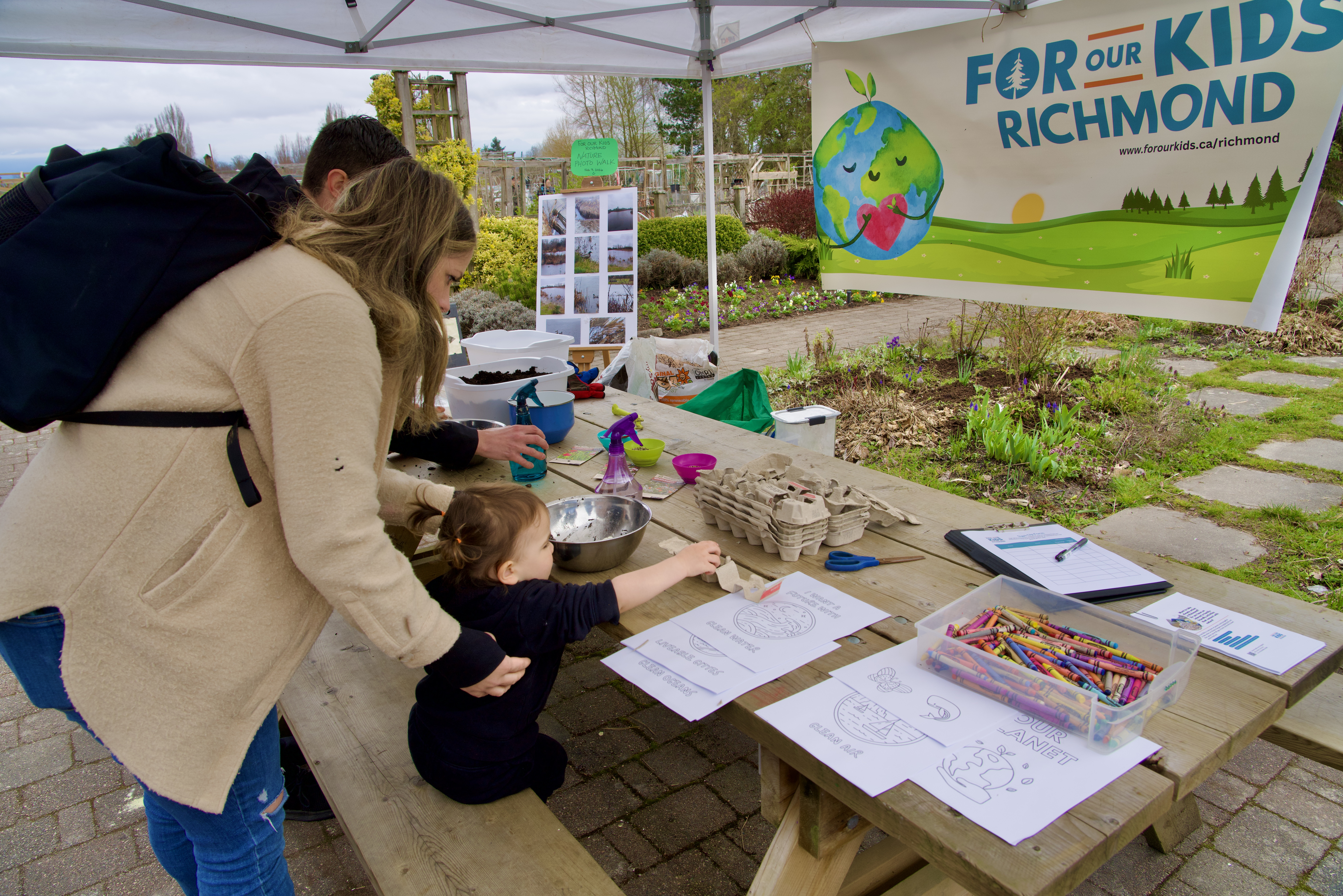 Families make pollinator-friendly seed balls with local organization For Our Kids